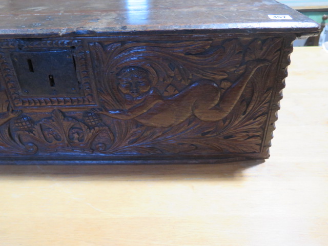 An 18th century oak box with a carved figural and crown front panel - Height 26cm x 79cm x 58cm - Image 3 of 5
