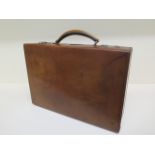 A good quality early 20th century leather attache/travel case by Finnigans Ltd Manchester with a