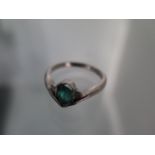 An 18ct white gold pear shape emerald and diamond ring, emerald is a good colour and has natural