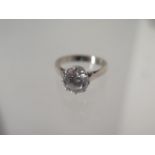 An 18ct white gold CZ ring - Diameter 8mm - ring size M - approx weight 5.3 grams