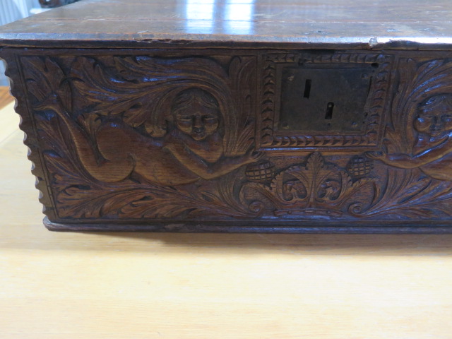An 18th century oak box with a carved figural and crown front panel - Height 26cm x 79cm x 58cm - Image 2 of 5