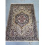 A hand knotted woolen Tabriz rug - 1.90m x 1.25m - in good condition