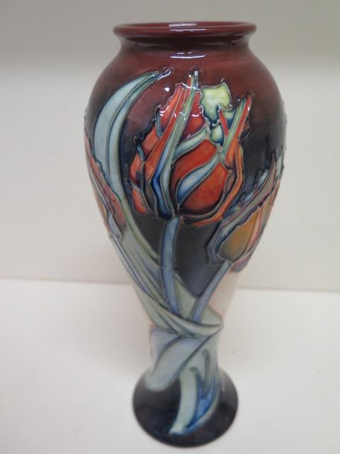 A Moorcroft baluster shaped red tulip vase - Height 27cm - in good condition, some crazing mainly to