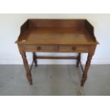 A Victorian mahogany two drawer washstand with an upstand - Height 86cm x 86cm x 48cm