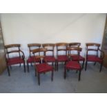 A set of eight 19th century mahogany dining chairs with drop in seats on turned legs including a