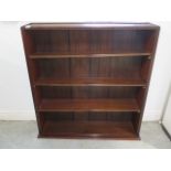 A bookcase with adjustable shelves - Height 106cm x Width 99cm x 22cm