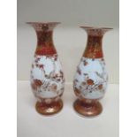 A near pair of Kutani bird decorated vases signed to the base - Height 25cm - restoration to base