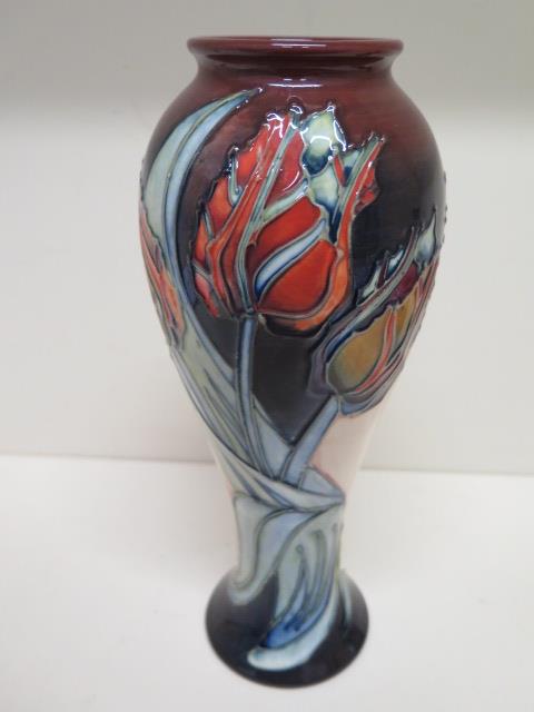 A Moorcroft baluster shaped red tulip vase - Height 27cm - in good condition, some crazing mainly to - Image 2 of 3