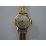 An 18ct yellow gold Tissot ladies manual wind watch on 18ct gold strap - 17mm case, approx weight 20