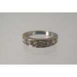 An 18ct white gold seven stone diamond ring size L/M - approx weight 5.7 grams - diamonds bright