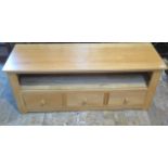 An oak three drawer media unit - 54cm x 127cm x 40cm