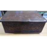 An 18th century oak box with a carved figural and crown front panel - Height 26cm x 79cm x 58cm
