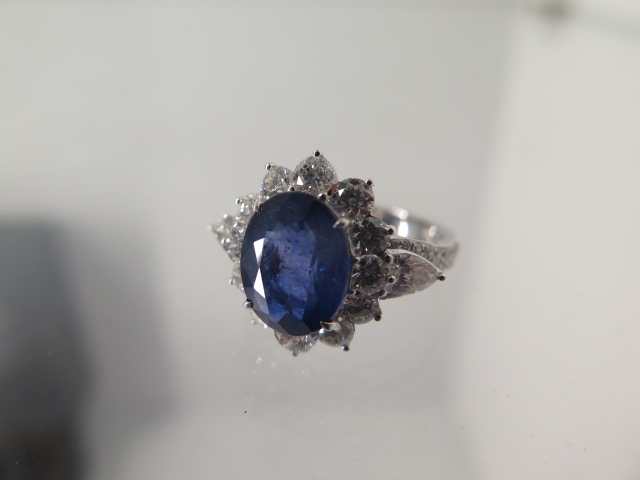 An 18ct white gold sapphire and diamond ring - sapphire approx 4.25ct, diamonds approx 2ct - ring