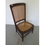 A cane seated nursing chair