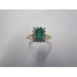 A hallmarked 18ct yellow gold Emerald and diamond ring size P, head approx 9.7mm x 8.6mm - approx