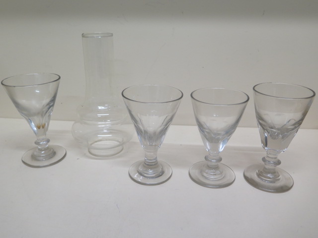 Four 19th century drinking glasses - tallest 15cm and an unusual oil lamp chimney