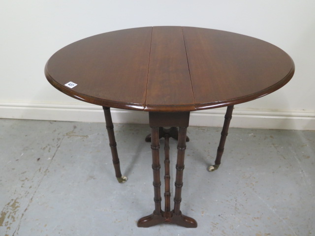 A late Victorian drop leaf mahogany Sutherland side table - Height 62cm x 82cm x 60cm - in good