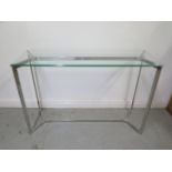 A chrome and glass side/hall table - Height 81cm x 120cm x 40cm