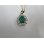 An emerald and diamond 18ct gold pendant approx 17mm x 15mm on an 18ct yellow gold 44cm chain -