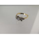 A hallmarked 18ct yellow gold 7 stone diamond ring - the central diamond approx 0.25ct - ring size O