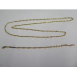 An 18ct yellow gold 80cm chain and a matching 21cm bracelet - approx weight 29 grams