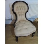 A Victorian buttoned re upholstered nursing chair - in polished restored condition - Height 92cm x
