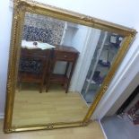 A decorative gilt wall/hall mirror