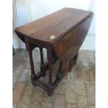 A 18th century oak dropleaf gateleg table with a long drawer - good colour and patina - Height