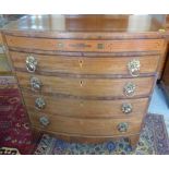 A good Regency mahogany bow fronted chest with an inlaid slim drawer above two graduating drawers