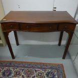 A mahogany three drawer serpentine fronted side/serving table - Height 76cm x 103cm x 49cm