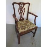 A Georgian mahogany elbow chair with entwined splat and upholstered seat - Height 99cm x Width
