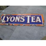 A Lyons Tea enamel sign - 30cm x 90cm - worn condition