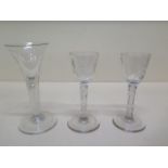 A pair of etched 18th/19th century cordial glasses - Height 14.5cm and another with teardrop air