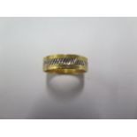 An 18ct yellow and white gold band ring size Q - approx weight 5.2 grams