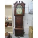 An 8 day long case clock with a painted broken arch dial signed - Height 210cm - with weights and