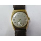 A 9ct yellow gold manual wind mid size wristwatch - 26mm case - on a leather strap, running, hands