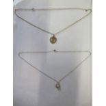 A 9ct gold opal pendant on a 9ct gold chain and a 9ct Manchester United pendant on 9ct gold