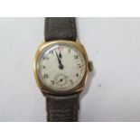 A 9ct yellow gold gents manual wind gents wristwatch with 29mm case on a leather strap - running,