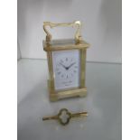 A brass carriage clock the dial signed Morrell & Hilton Huntingdon - Height 15cm with handle up -