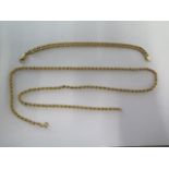 A 9ct yellow gold 64cm chain and a 9ct yellow gold 20cm bracelet - total weight approx 14.2 grams