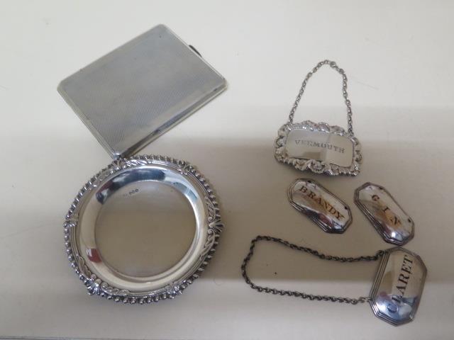 A silver pin dish - Diameter 9cm and a silver cigarette case - approx weight 5.5 troy oz and four