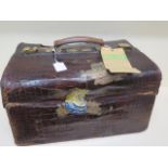 An early 20th century crocodile travel case by Finnigan makers with a fitted interior including