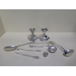Two silver sugar nips, a silver ladle, a silver spoon, a silver salt, small silver pot and a pair of
