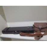 A Gunmark leather shotgun case, a Brady cartridge bag and a cartridge belt