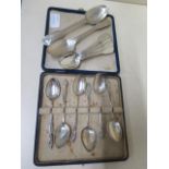 A pair of silver dessert spoons London 1849 Henry Hyde and six silver teaspoons London 1818 and