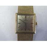 An Omega 9ct yellow gold bracelet manual wind wristwatch 25mm case, approx 55 grams, in running