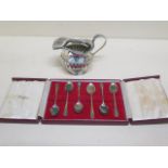 A set of six silver coffee spoons, boxed and a silver cream jug - total weight approx 5.9 troy oz