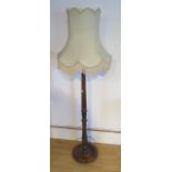 A mahogany standard lamp and shade in good condition