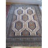 A hand knotted woollen Turkman rug - 2.80m x 2.08m