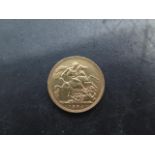 A Victorian gold full sovereign coin dated 1894